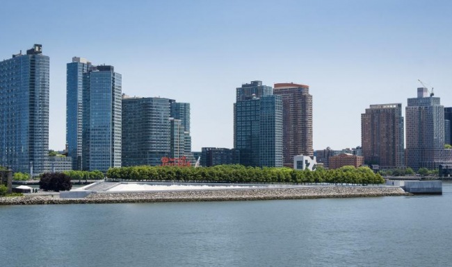 a city skyline across a body of water