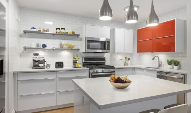 a kitchen with a white countertop and a white kitchen