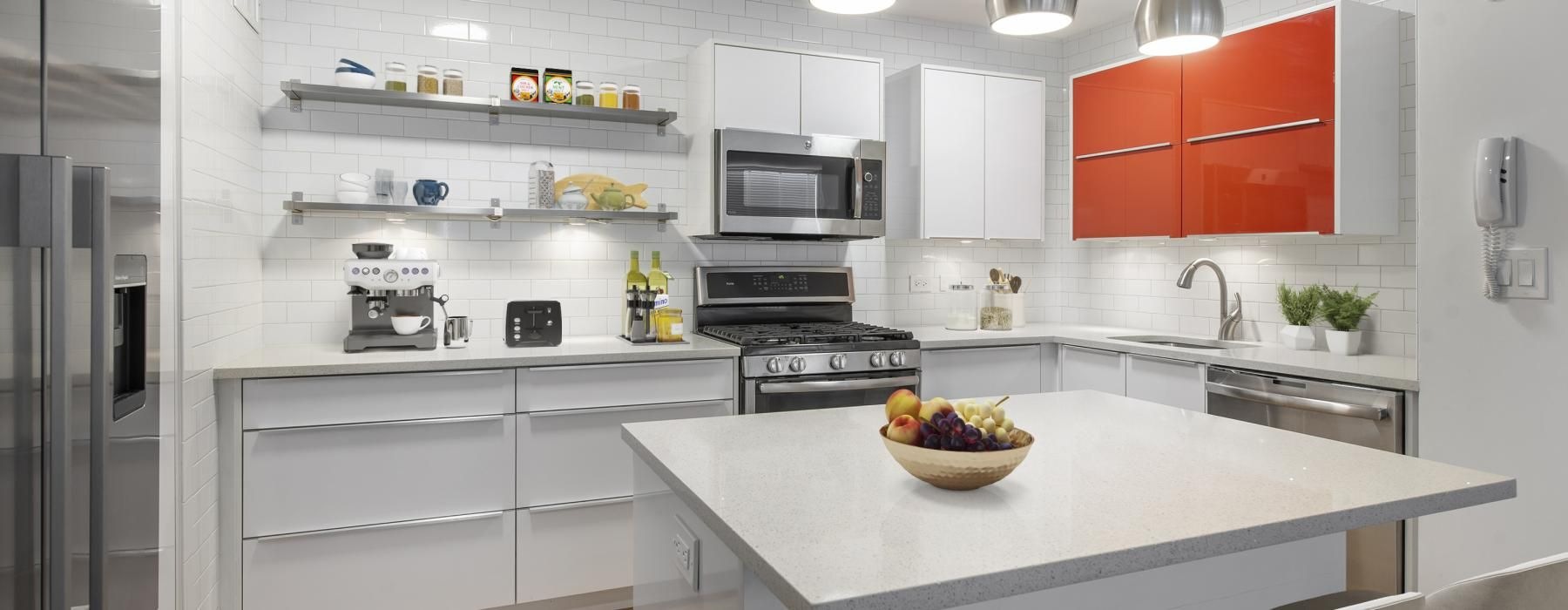 a kitchen with a white countertop and a white kitchen